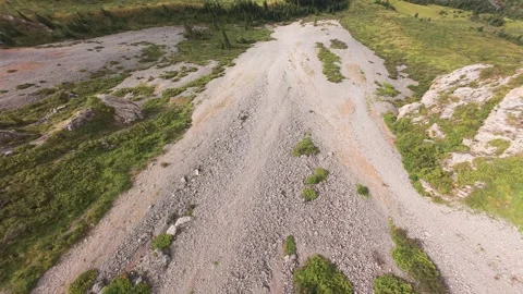 FPV drone diving along the cliffs to the river Stock-Footage 296553482