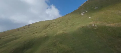 FPV Drone diving down mountain grassy hillside -  flatColor 120FPS 3 Stock Footage 170270696