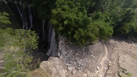 FPV drone diving down Tumpak Sewu Waterfall East Java Indonesia Stock-Footage 328956760