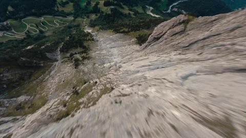 Fpv drone diving the Mattenberg in Grindelwald Switzerland fast pace cinematic Stock Footage 255503563