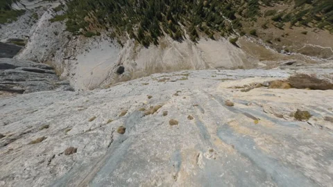 FPV Drone Diving Off Rocky Ridge in the Dolomites Stock Footage 327441516