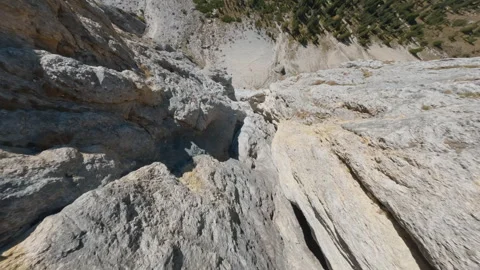 FPV Drone Diving Off Rocky Ridge in the Dolomites Stock Footage 327441829