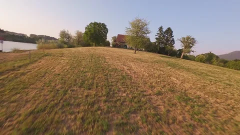FPV Drone Doing a Back Flip in the Air at Sunset, Aerial Stunt Stock Footage 341237701