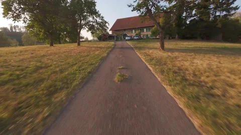 FPV Drone Doing a Barrel Roll in the Air at Sunset, Aerial Stunt Stock Footage 341237760