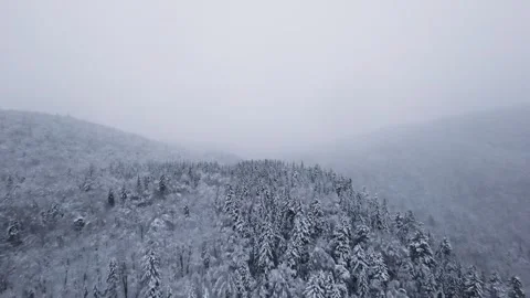 Fpv drone drifting above snowy residential mountain area Stock Footage 321251231