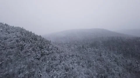 Fpv drone drifting low across snowy open valley floor Stock Footage 321249882
