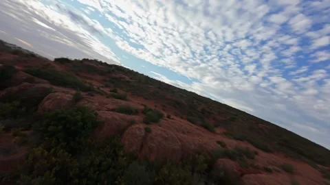 FPV drone dynamic low flight over red rocks landscape in Provence Stock Footage 335371389