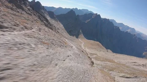 FPV drone fast cinematic flying in high rocky mountains Stock Footage 169280537