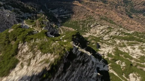 FPV Drone Fast Dive Down Autumn Mountain Slope, 4K Stock Footage 321204401