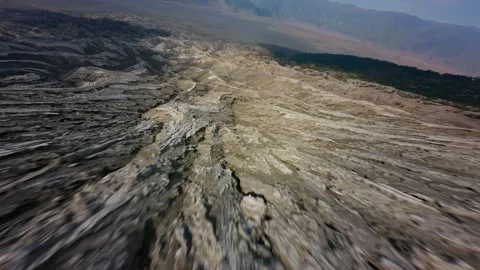 FPV drone flies down solidified lava Stock Footage 277183185