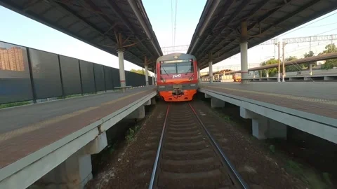 Fpv drone flies next to a moving electric train Video stock 229528924