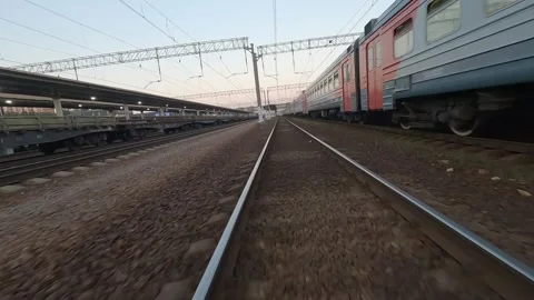 Fpv drone flies next to a moving electric train Video stock 229528929