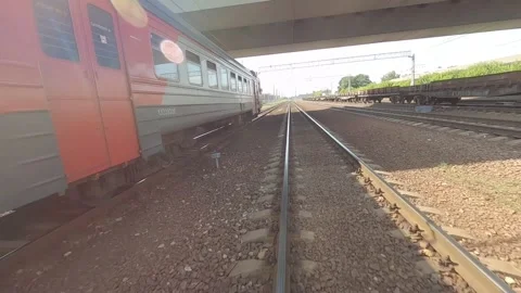 Fpv drone flies next to a moving electric train Video stock 229528946
