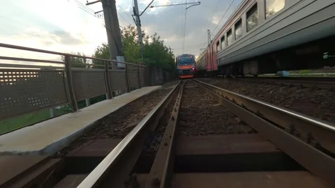 Fpv drone flies next to a moving electric train Video stock 229528989