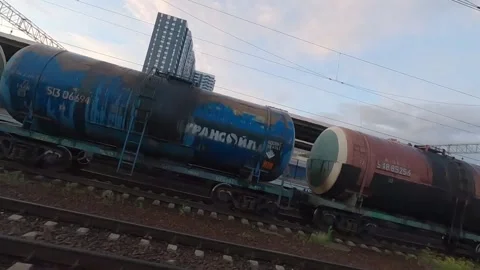 Fpv drone flies next to a moving electric train Video stock 229529060