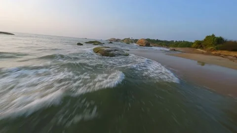 FPV drone flies over the beach and jungle at sunset Video stock 224334138