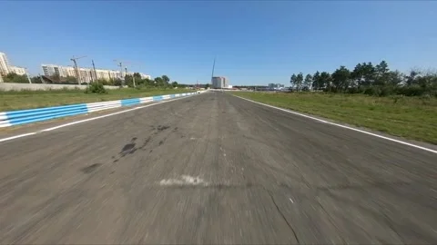 FPV drone flies over an empty race track before the competition. 库存影片 169410946