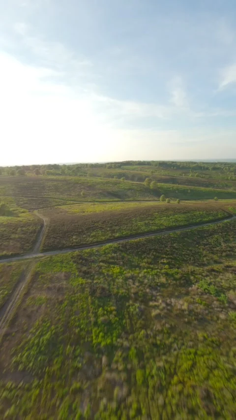 Fpv drone flies over trails towards the setting sun Stock Footage 243755665