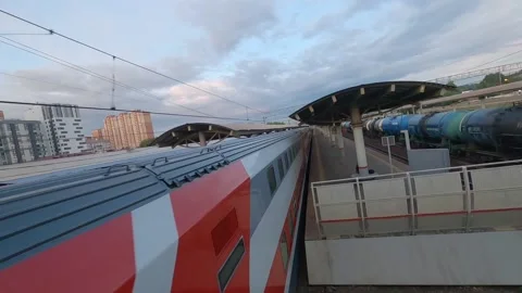 Fpv Drone flies past a moving passenger train and electric train Stock Footage 229529011