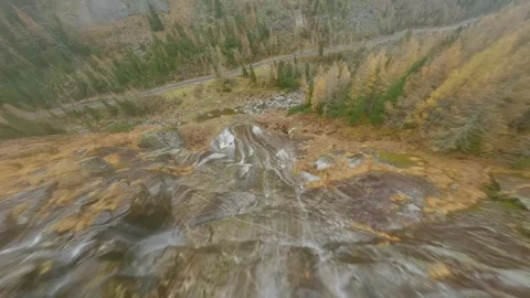 FPV drone flies quickly through the fog close to the stone surface. Austria Stock Footage 303568415