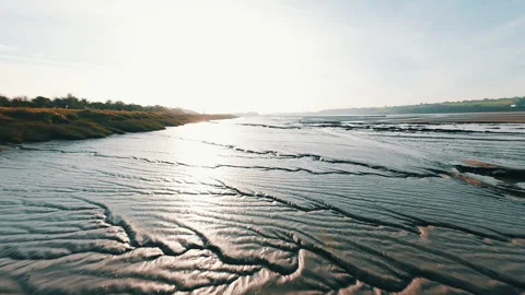 Fpv Drone Flight Across A Muddy Riverbank Stock Footage 298658885