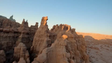 FPV Drone Flight Along a Red Rock Ridge in Goblin Valley During Sunrise Stock Footage 286229209