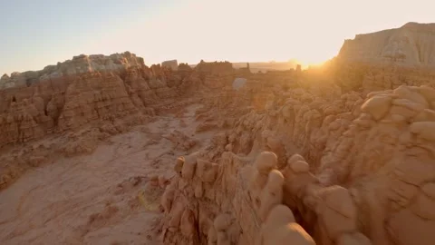 FPV Drone Flight Along a Red Rock Ridge in Goblin Valley During Sunrise Stock Footage 286229252