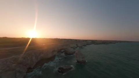 FPV drone flight along rocky coastline and sea arch at Tyulenovo, Bulgaria. Видео 342224627