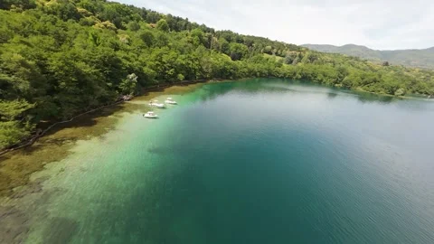 FPV Drone Flight Along a Summer Beach With People, Umbrellas and Trampoline Video stock 336966207