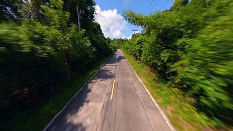 FPV drone flight along tropical road through jungle in Thailand Stock Footage 336656603