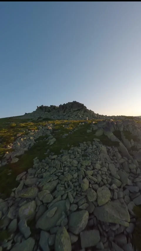 FPV drone flight approaching and crossing rocky outcrop on Vitosha Mountain. Stock Footage 341114880