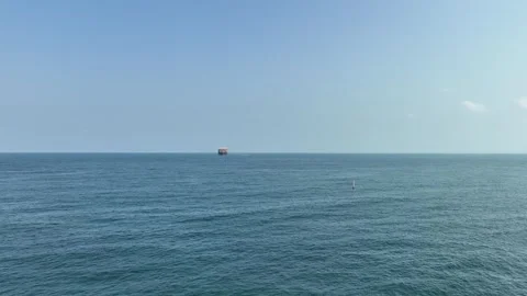An FPV drone flight approaching a massive cargo ship Stock Footage 294067083