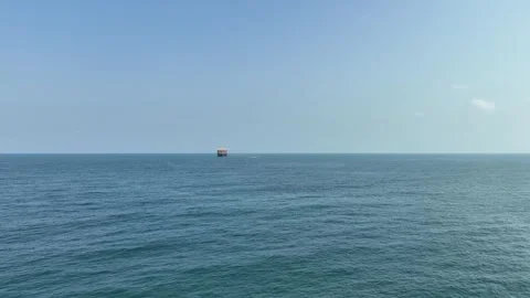 An FPV drone flight approaching a massive cargo ship Stock Footage 294067089
