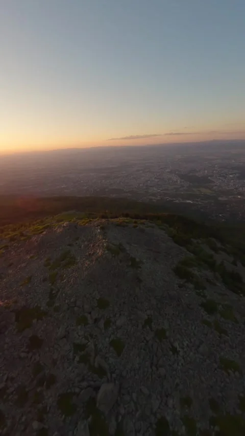 FPV drone flight around Kamen Del rocky peak at sunset in Sofia, Bulgaria. Stock Footage 341096124