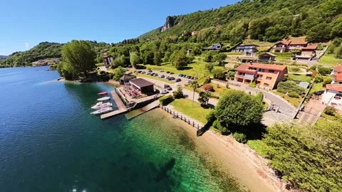 FPV Drone Flight Around a Lakeside Bar During Lunchtime Video stock 335879418