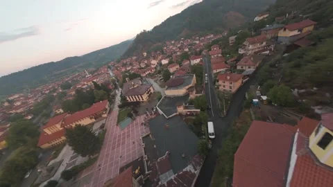 FPV drone flight around Orthodox church over mountain town of Belitsa, Bulgaria. Stock-Footage 343686335