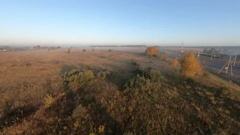 Fpv drone flight in a field with white fog morning Stock Footage 222939535