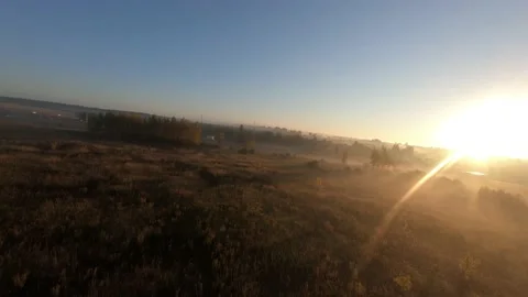 Fpv drone flight in a field with white fog morning Stock Footage 222940901