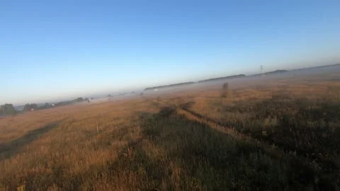 Fpv drone flight in a field with white fog morning Stock Footage 222941000
