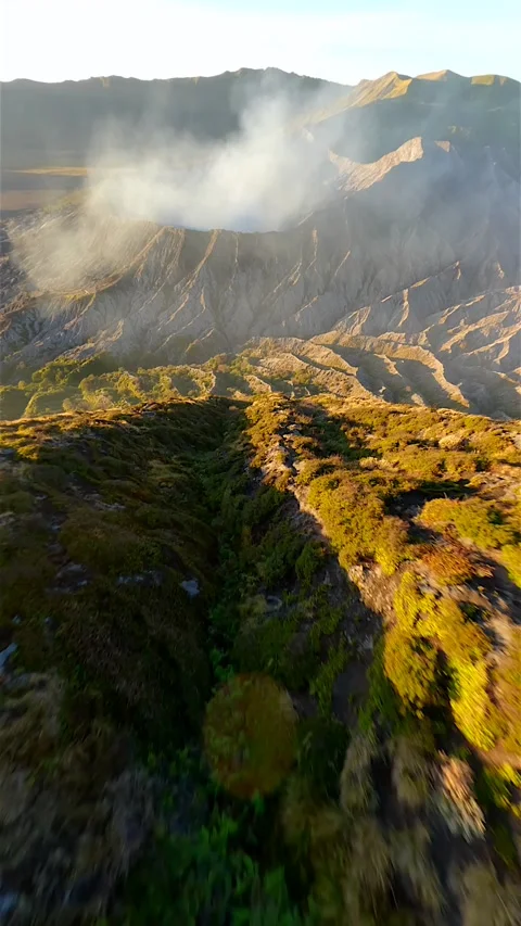 FPV drone flight into Mount Bromo crater at sunrise in East Java, Indonesia Stock Footage 312857601