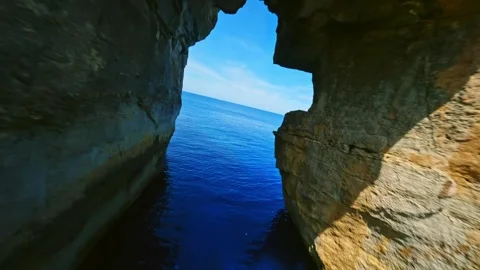 FPV drone flight in natural arch on Gozo island, Malta island Stock Footage 314669002