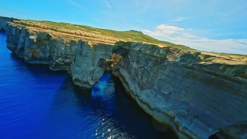 FPV drone flight in natural arch on Gozo island, Maltese island Stock Footage 314669016