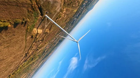 FPV drone flight in open nature landscape. Bright blue sky sunshine over modern Stock Footage 189414386