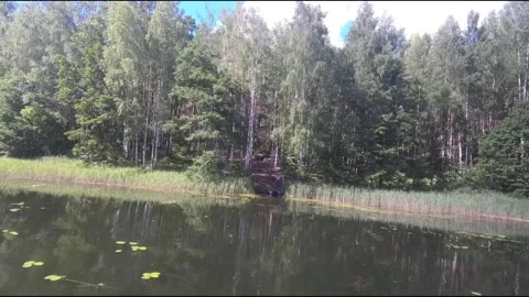 Fpv drone flight over blue lakes in a green forest over water Stock Footage 208610280