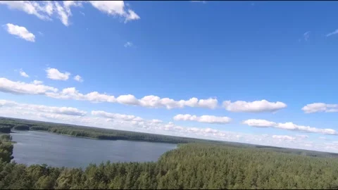 Fpv drone flight over blue lakes in a green forest over water Stock Footage 208611901