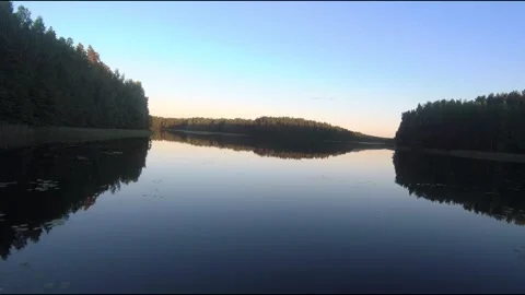 Fpv drone flight over blue lakes in a green forest over water Stock Footage 208613161