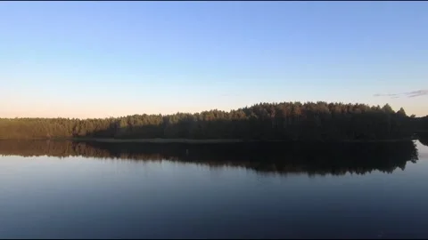 Fpv drone flight over blue lakes in a green forest over water Stock Footage 208613214