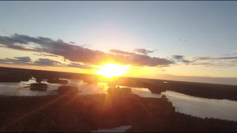 Fpv drone flight over blue lakes in a green forest over water Stock Footage 208613251
