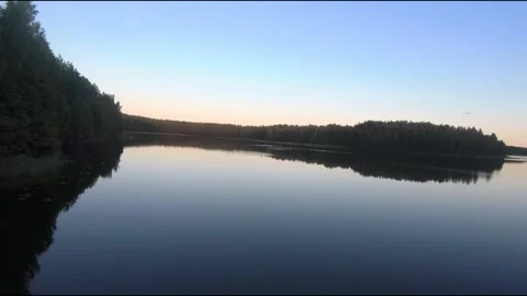 Fpv drone flight over blue lakes in a green forest over water Stock Footage 208613479