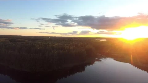 Fpv drone flight over blue lakes in a green forest over water Stock Footage 208613615